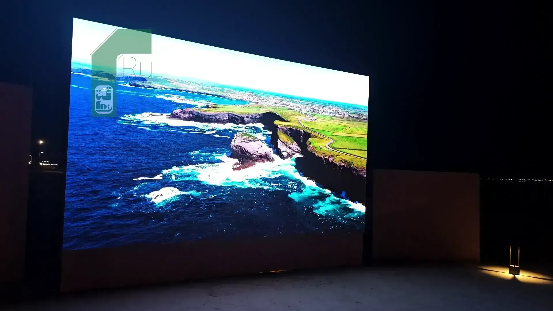 Ruqaqa outdoor flat LED screen at a resort displaying an ultra-sharp coastal landscape